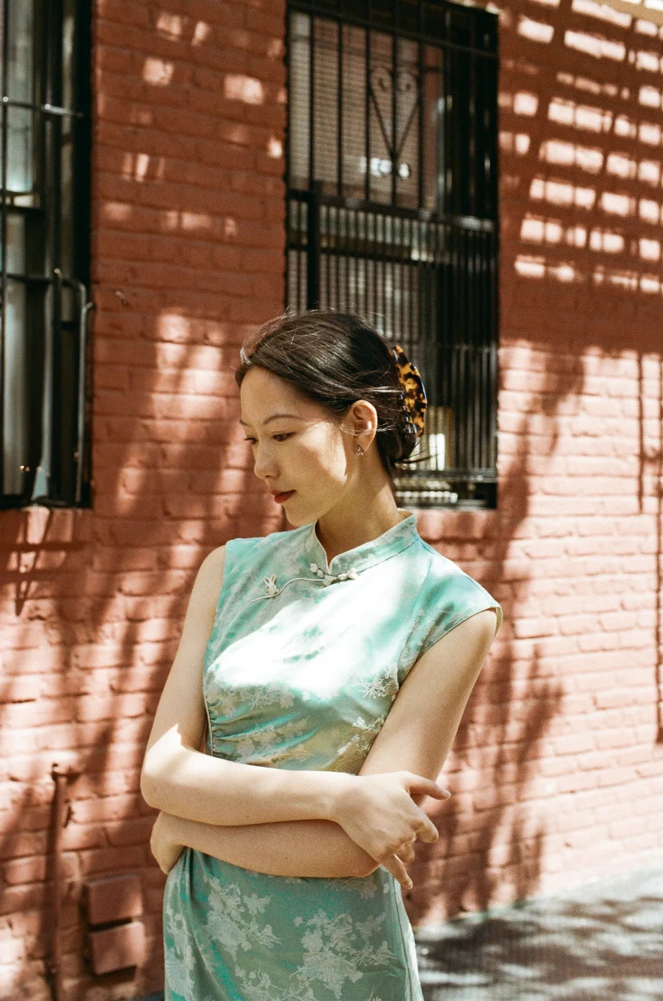 Mint clothing in striped sunlight.