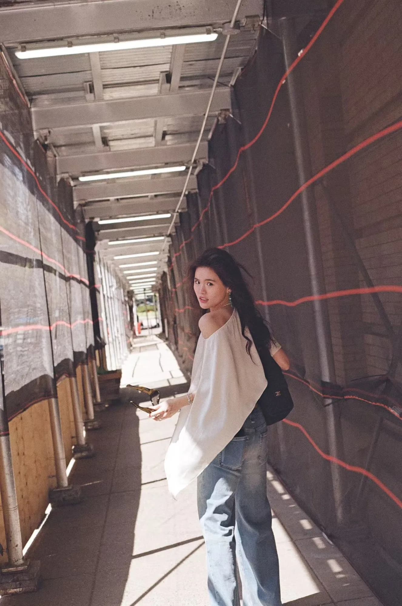 A white blouse in a covered walkway.