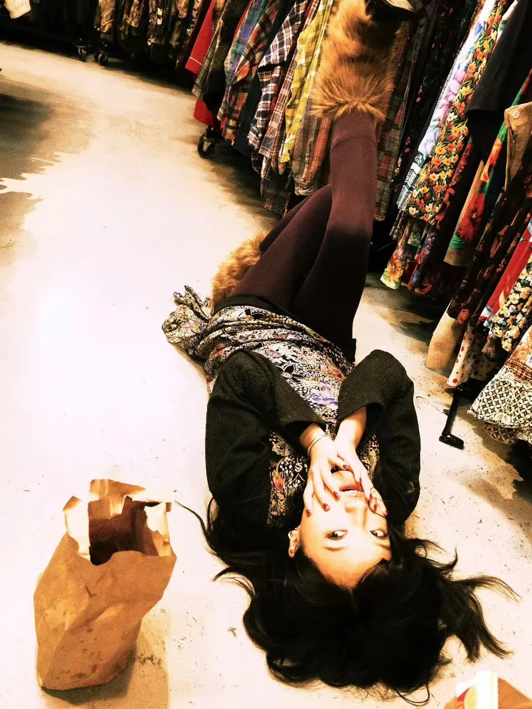 A reclining figure on a warm shop floor.