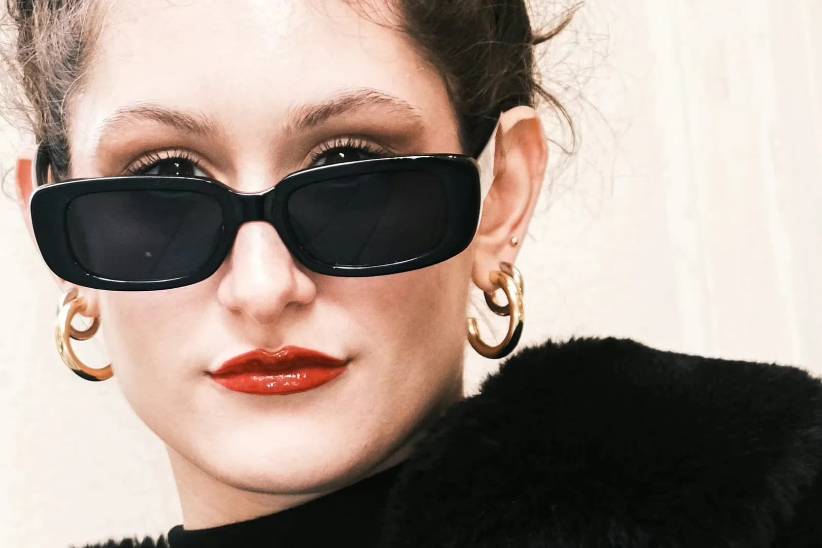 A close portrait with dark sunglasses.
