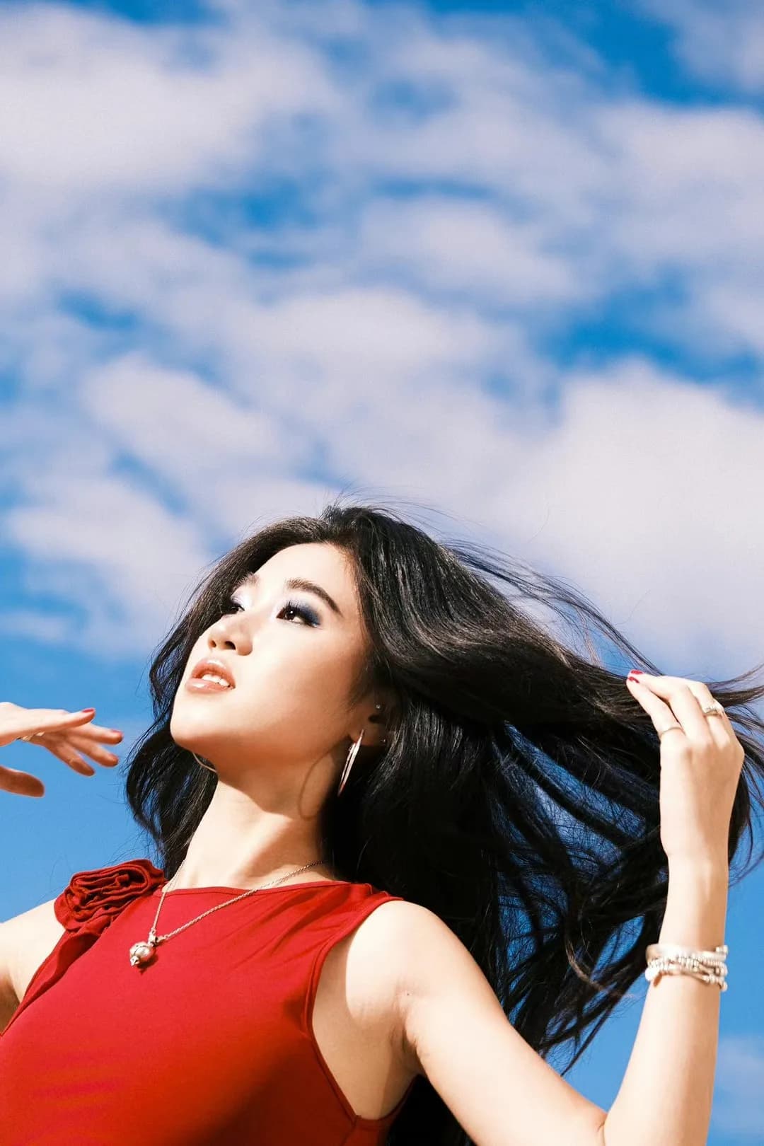 A red top beneath blue sky.