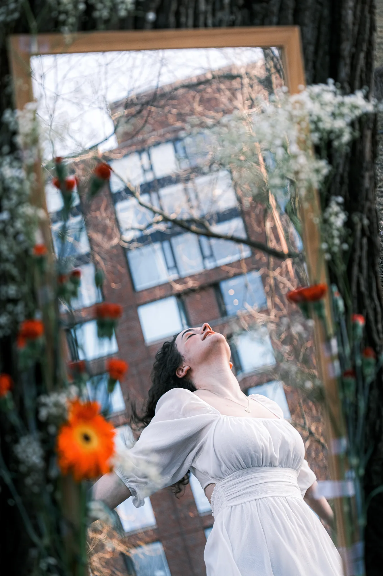 A mirrored portrait among muted warm city colors.