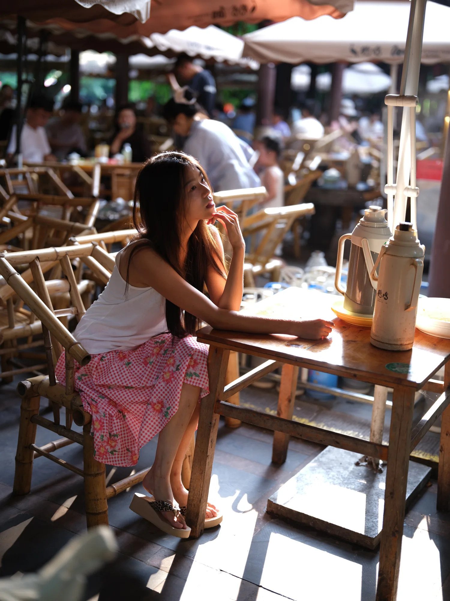 A seated portrait in a warm cafe.
