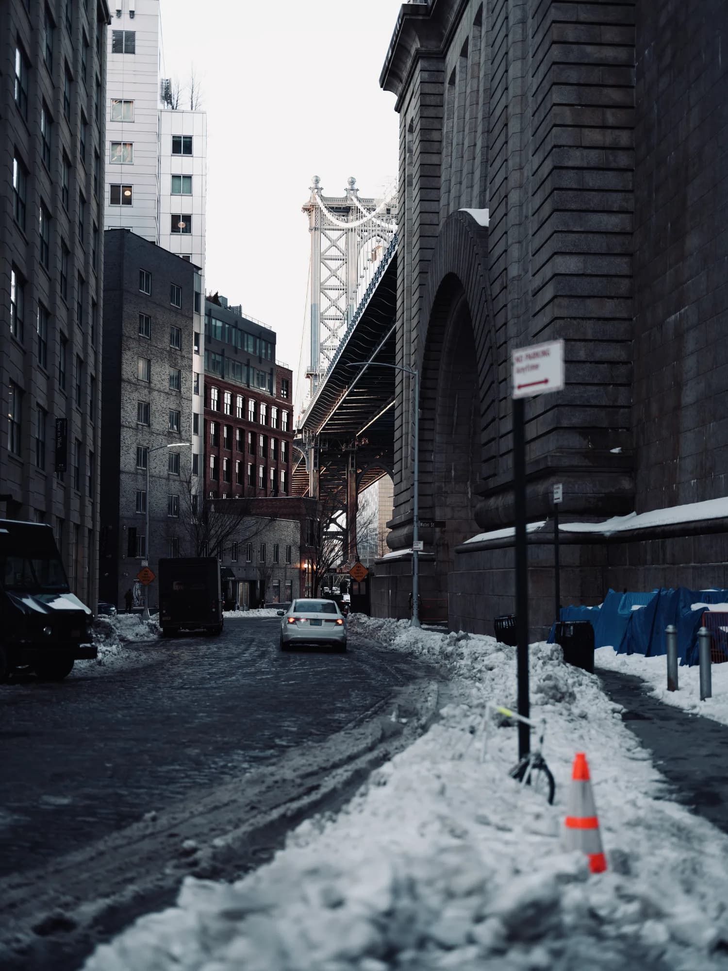 A desaturated snowy city street.