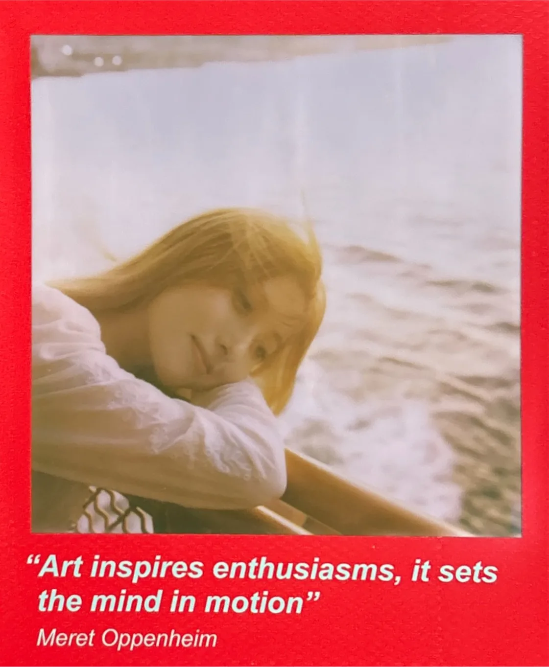 A red-bordered instant photograph.