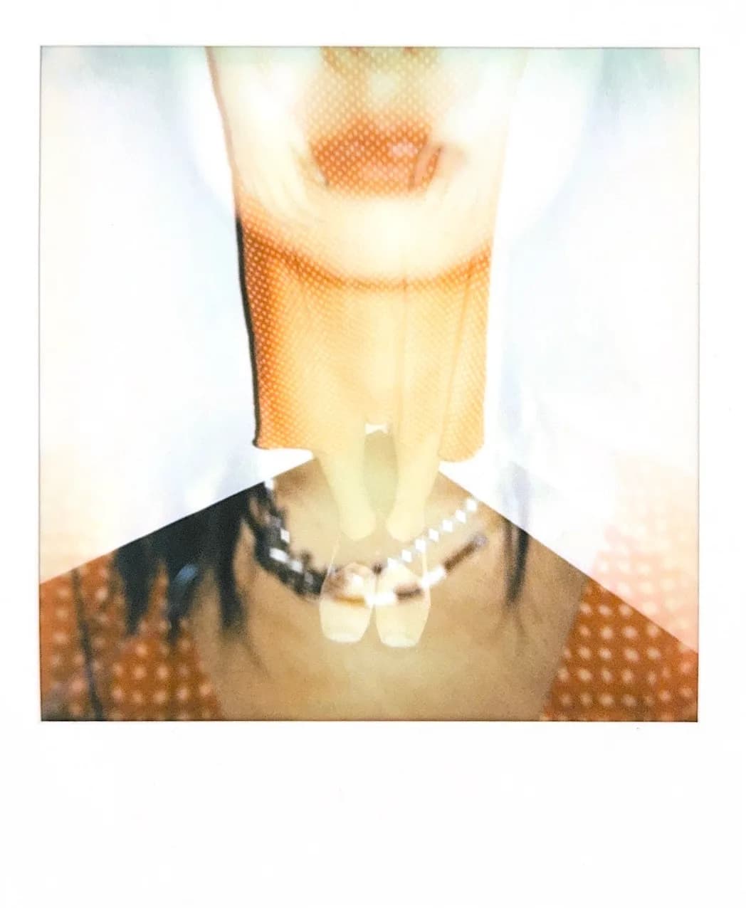 A warm instant portrait with a net headpiece.